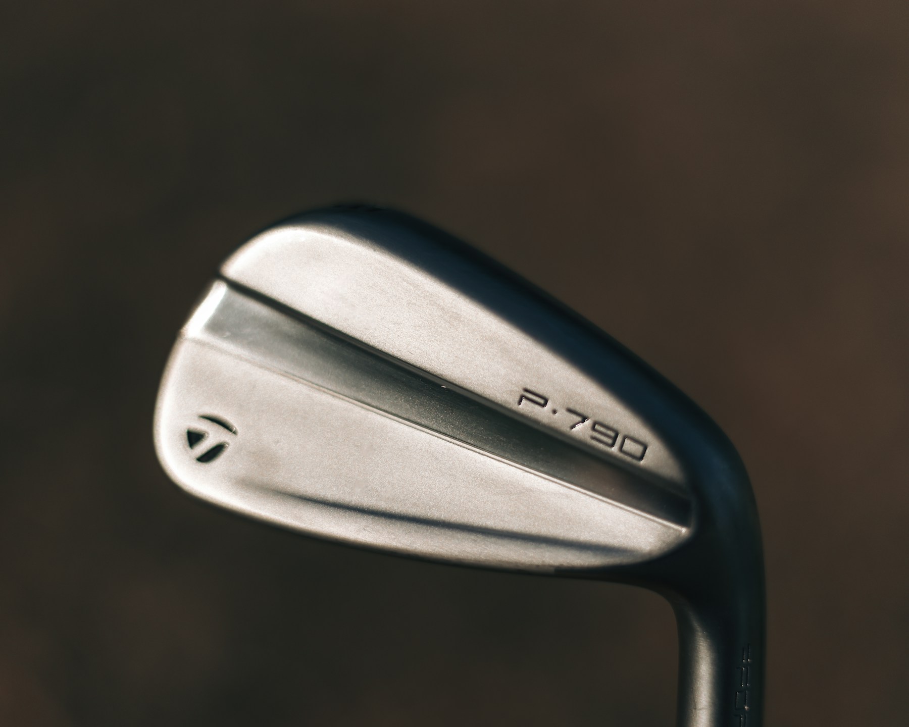Real close-up photograph of a polished golf iron